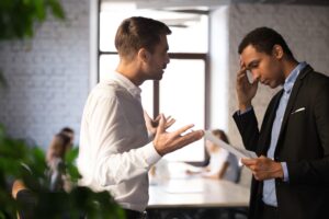 Não seja refém dos seus colaboradores 2 Angry Caucasian Boss Shouting Stressed African American Employee Blaming Document Mistake Mad Employer Lecture Depressed Black Worker Frustrated With Bad Financial Statistics Report - Contabilidade Digital para todo o Brasil | GG Contabilidade